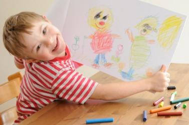 Special Education student showing his drawing